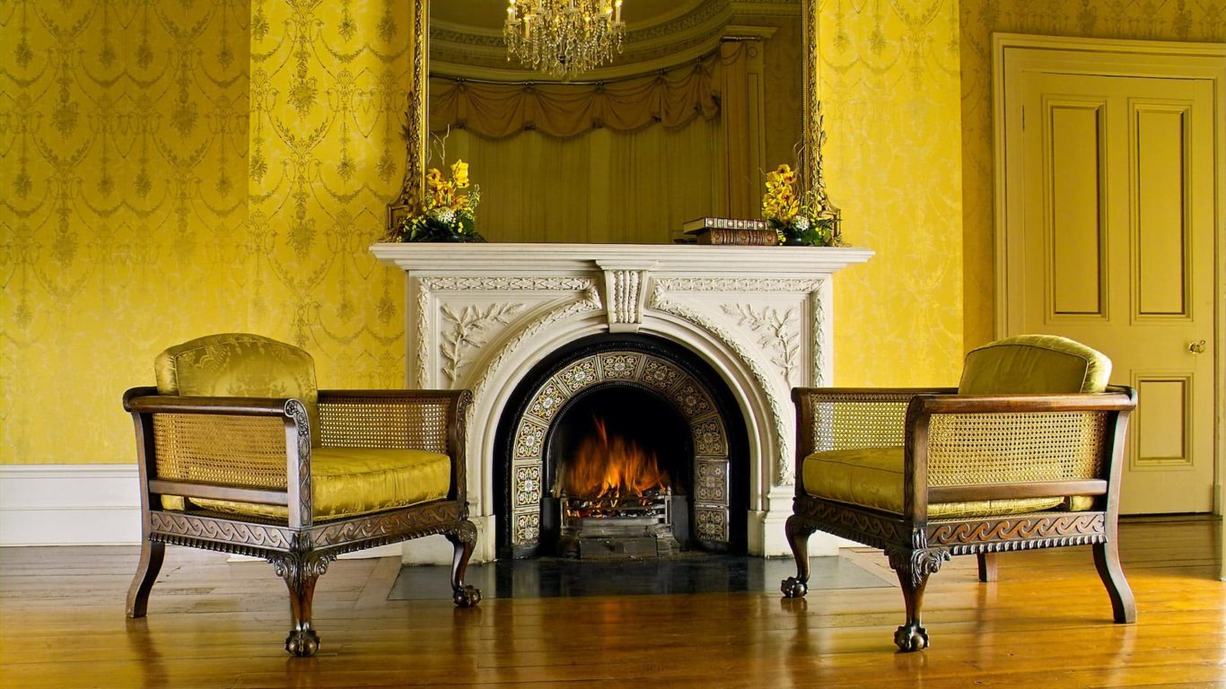 lyrath-manor-house-fireplace-yellow-room-2-chairs