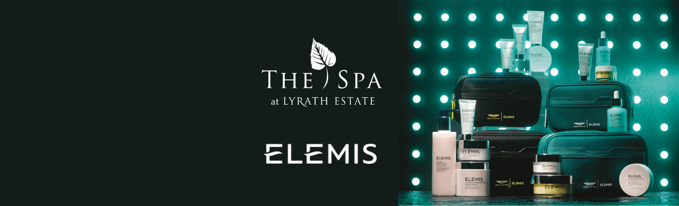Display of Elemis skincare products and travel bags arranged in front of a green and black dotted background, with