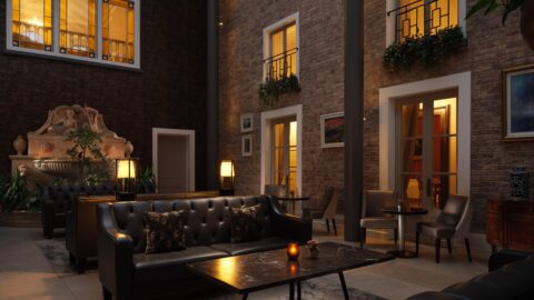 Cosy hotel lounge with plush sofas, elegant lighting, warm decor, and inviting ambience for a relaxing stay.
