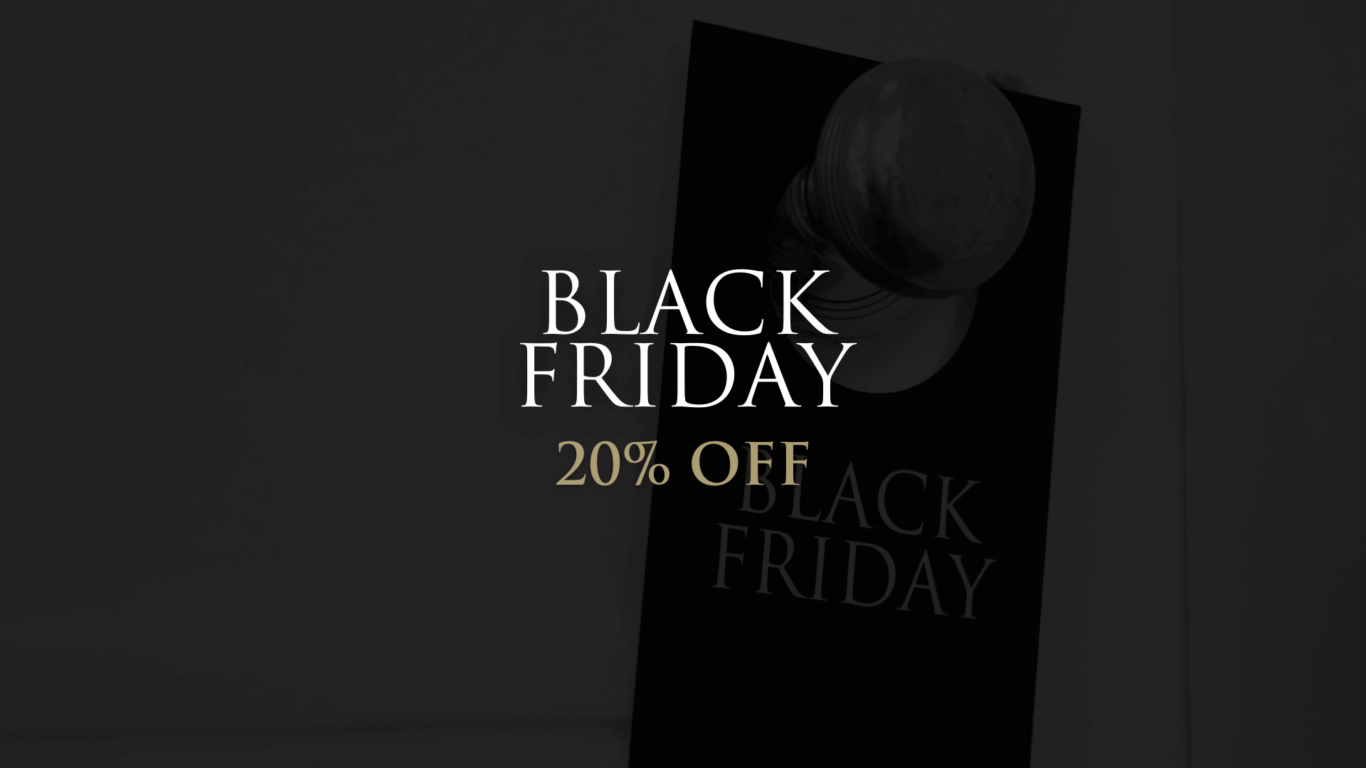 Black Friday 20% Off text displayed over a blurred background featuring a door handle with a Black Friday sign hanging on it.
