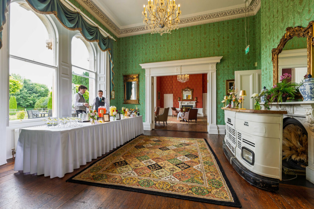 A room with a large window and a large rug.